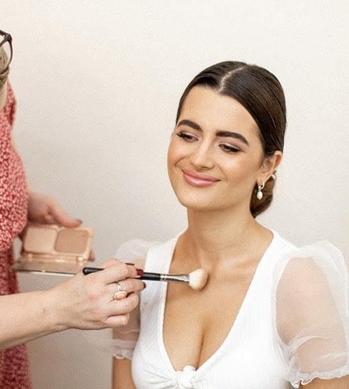 Lexi applying makeup to a model. Makeup Lessons In Essex - Lexi Brownfield.