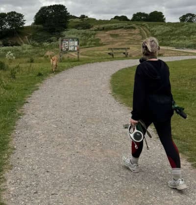 Picture of Lexi walking her dog. Meet Lexi Brownfield.